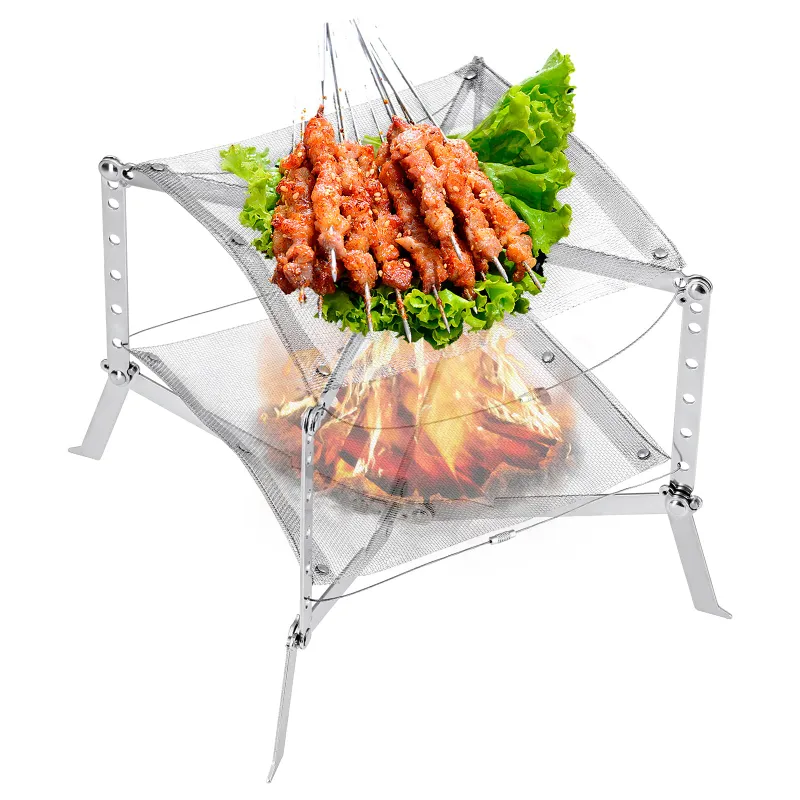 KingCamp campfire grill positioned over an open flame outdoors