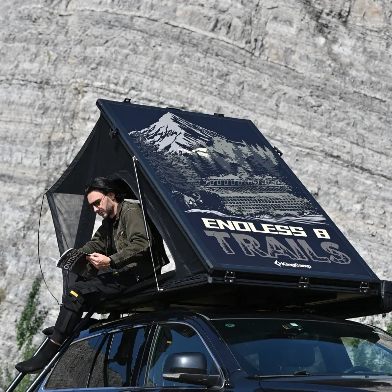 KingCamp car tent attached to a vehicle and set up at a campsite